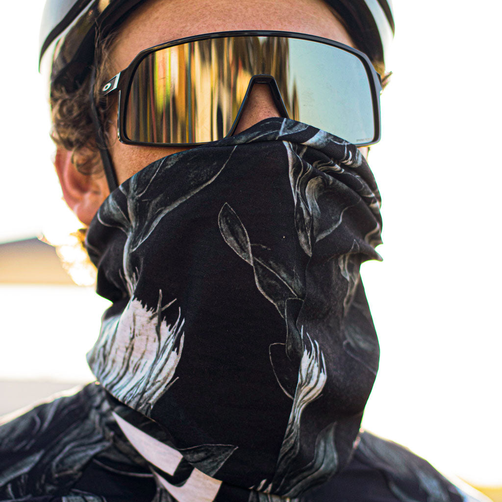 cyclist wearing black and white headscarf